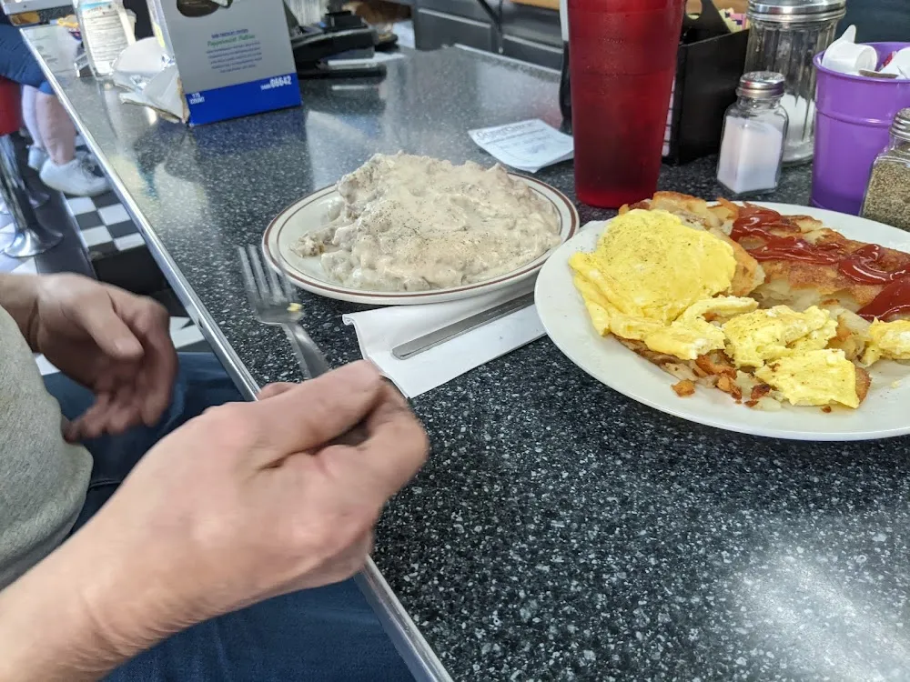Country Fried Steak with Sausage Gravy Home Fries and Scrambled Eggs